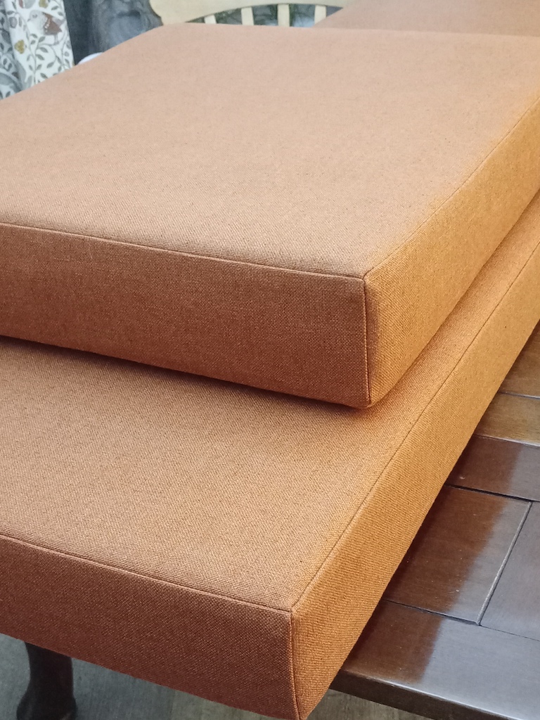 Burnt orange campervan seats with a rich, warm tone