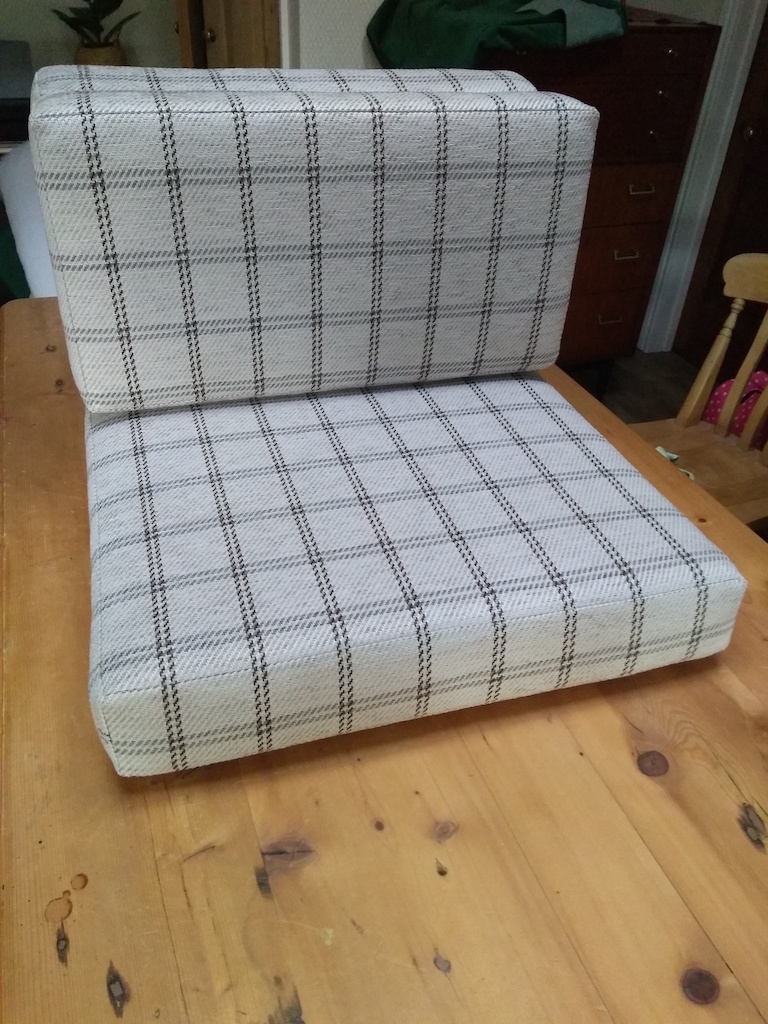 Two checked campervan cushions
