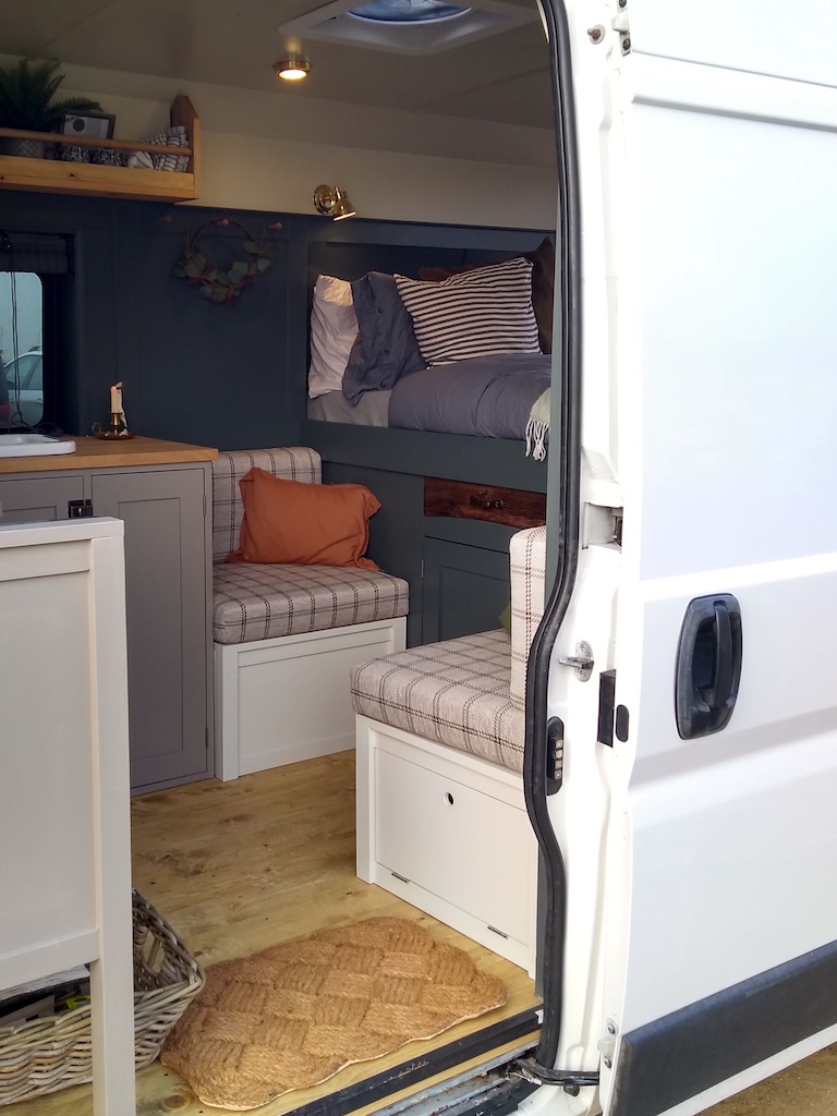 Checked campervan cushions installed in a van