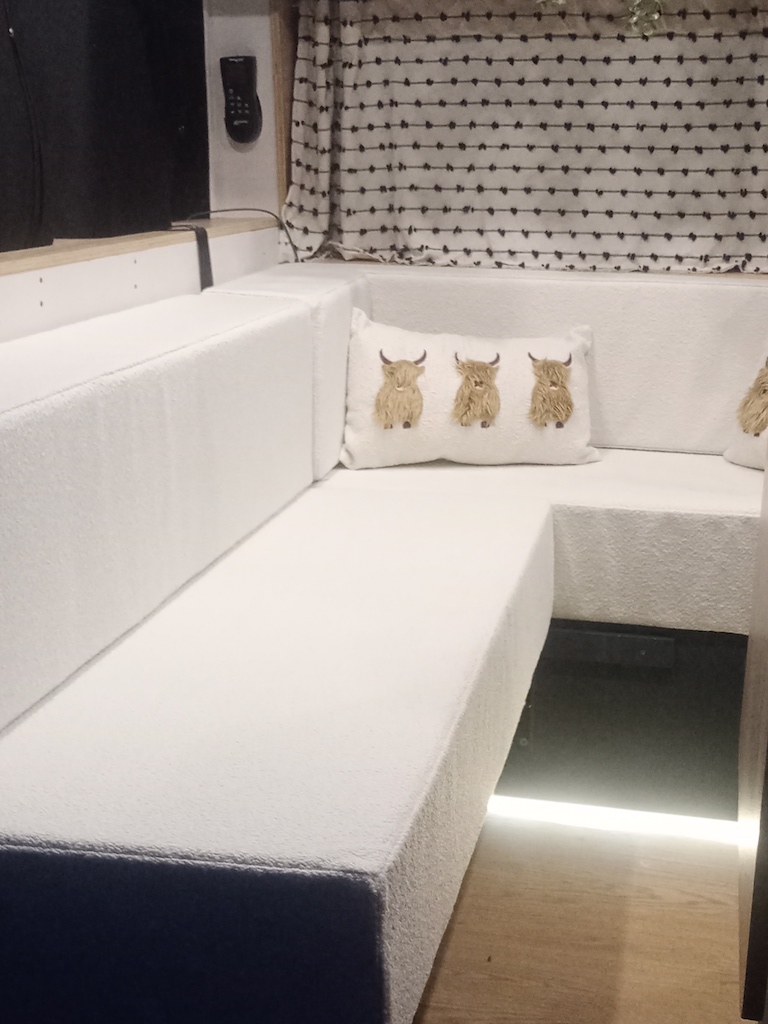 Ivory boucle campervan seats with a classic, timeless appeal
