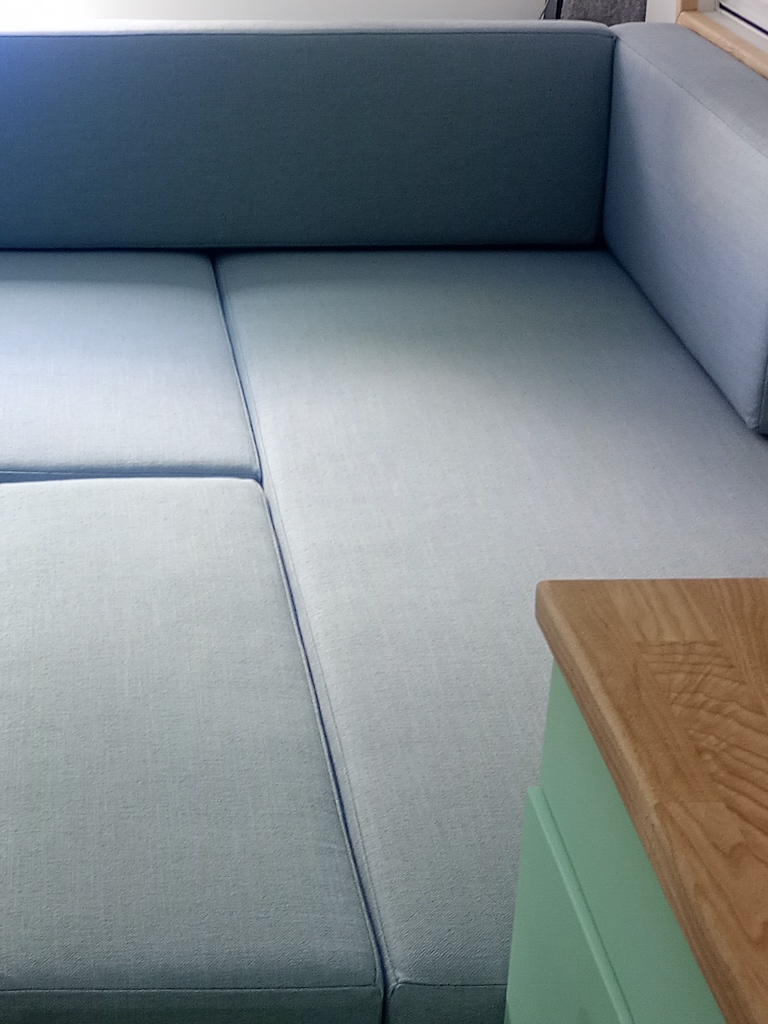 Campervan bed arrangement of cushions covered in Koki Powder from Warwick Fabrics RHS