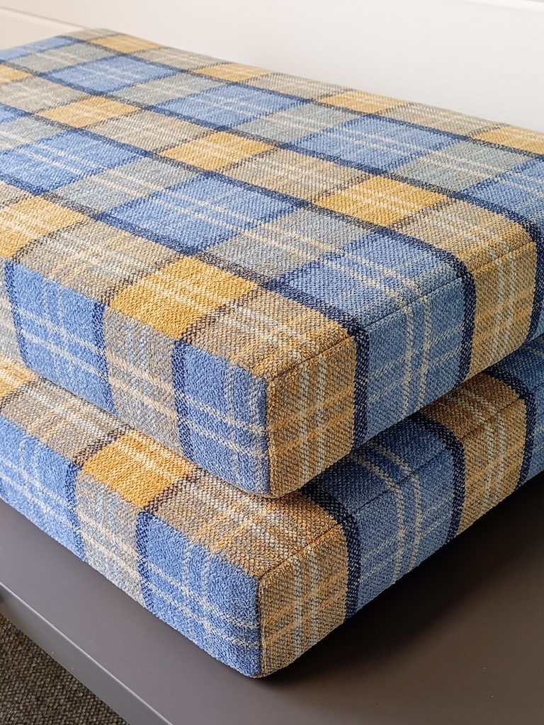 Campervan seats upholstered in Cristina Marrone Lana Ocean Plaid with perfectly aligned check pattern corner detail