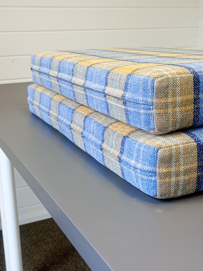Campervan seats upholstered in Cristina Marrone Lana Ocean Plaid with check pattern corner and rear zip detail