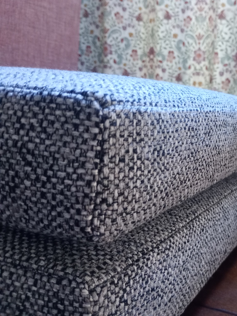 Corner detail of grey tweed campervan cushions