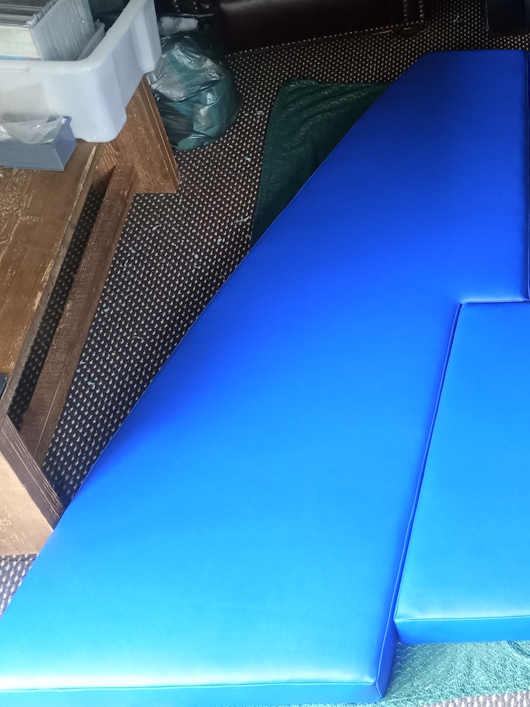 Blue vinyl v-berth seat and bed cushions for a boat LHS