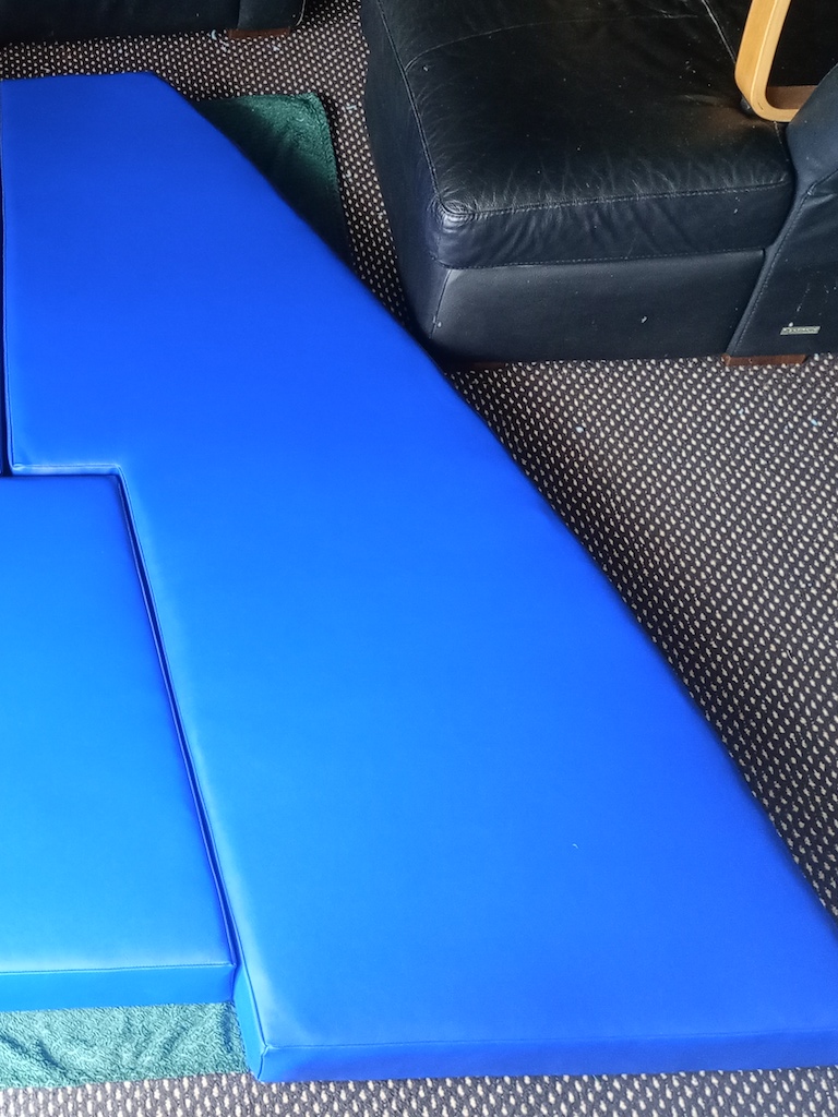 Blue vinyl v-berth seat and bed cushions for a boat RHS