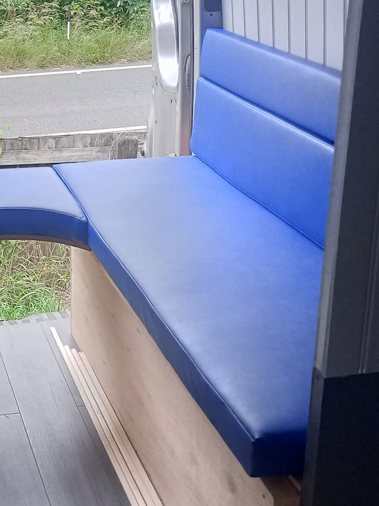 Campervan bench seating arrangement finished in vinyl RHS